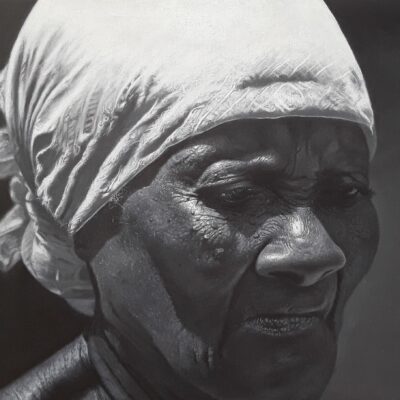 The portrait of dignity preserved in daily survival. Neya personifies tenacity and pride that remain intact despite the visible scars of a life of relentless struggle